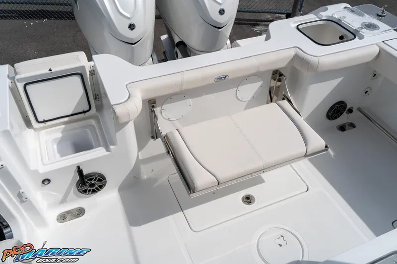 Slide: The Image of 2026 Sea Hunt Gamefish 30 boat interior with foldable seat and storage compartments. - 26