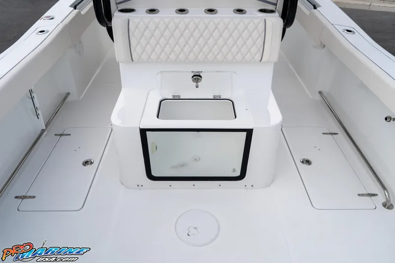 Slide: The Image of 2026 Sea Hunt Gamefish 30 boat interior with storage compartments and seating. - 30