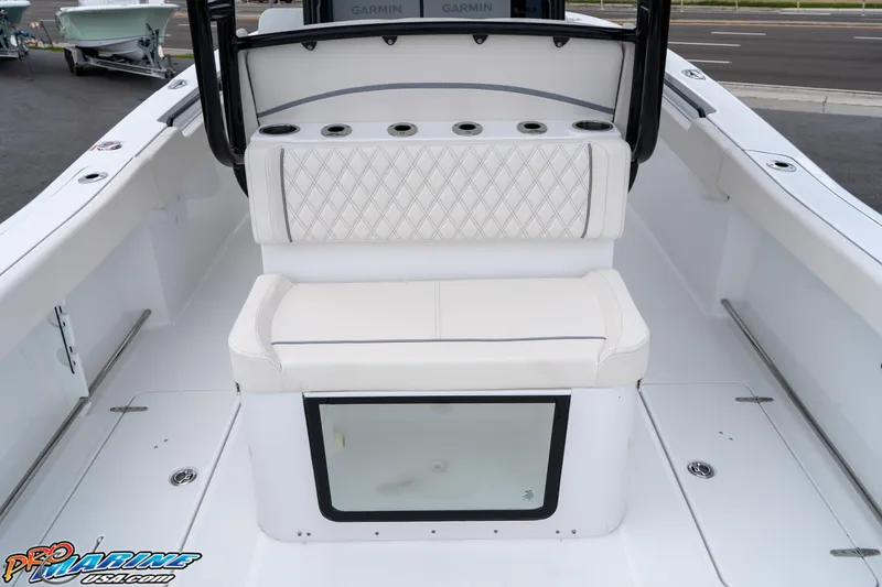 Slide: The Image of 2026 Sea Hunt Gamefish 30 boat interior with cushioned seating and rod holders. - 31