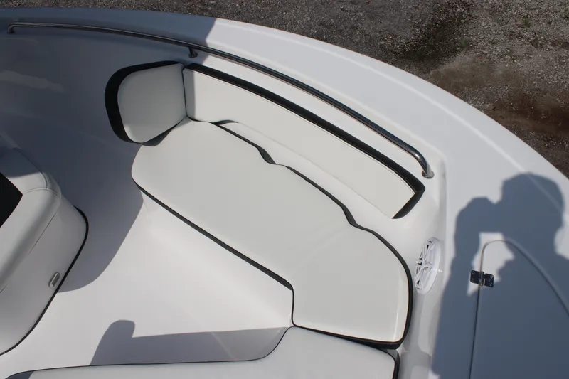 Slide: The Image of 2026 Tidewater 198 CC Adventure boat interior with white cushioned seating. - 21