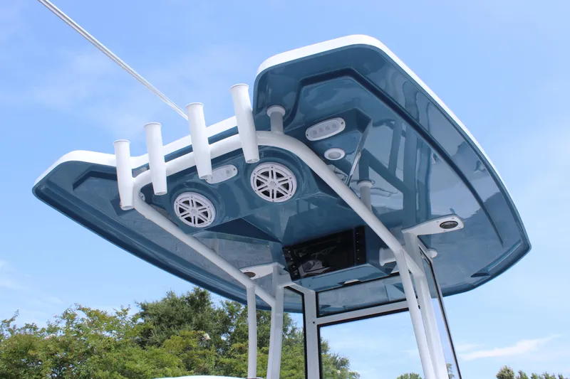 Slide: The Image of Tidewater 198 CC Adventure 2026 boat T-top with speakers and rod holders. - 23