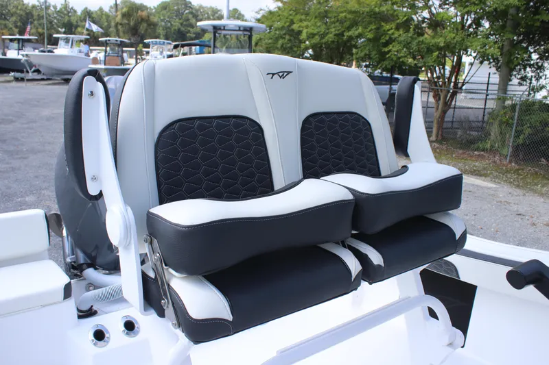 Slide: The Image of 2026 Tidewater 198 CC Adventure boat seats, featuring black and white cushioned design. - 24