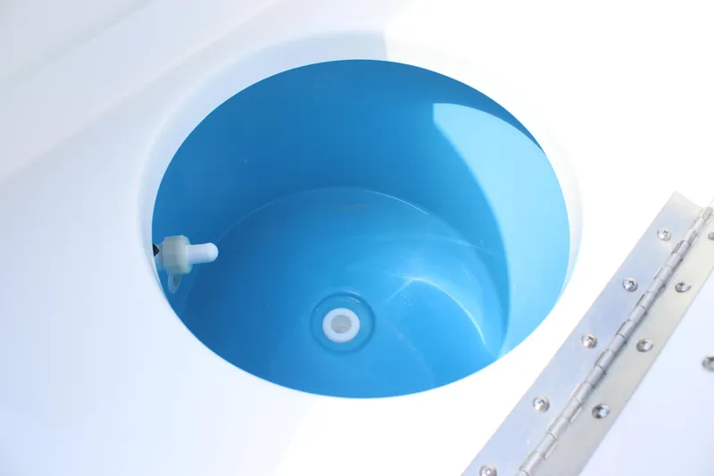 Slide: The Image of Livewell of 2026 Tidewater 198 CC Adventure boat, featuring a blue interior. - 28