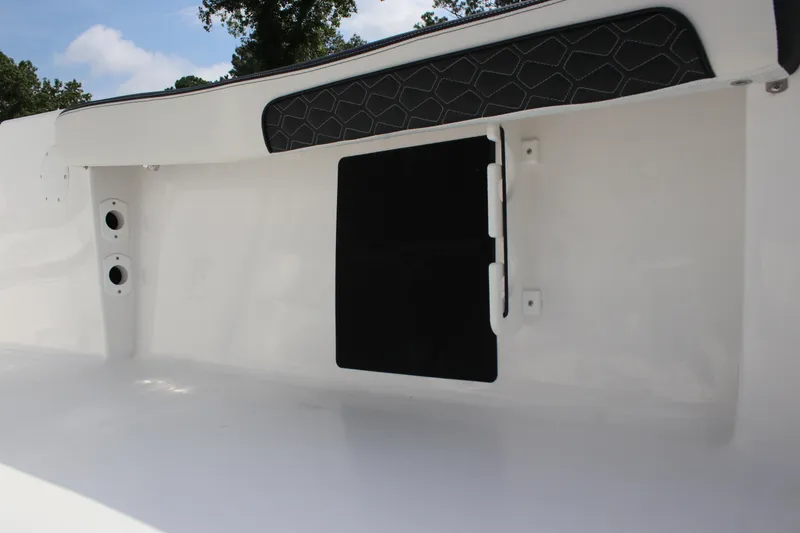 Slide: The Image of Interior view of 2026 Tidewater 198 CC Adventure boat, featuring sleek white design and storage compartment. - 32