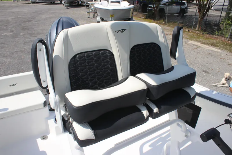 Slide: The Image of 2026 Tidewater 198 CC Adventure boat seats with black and white upholstery. - 8
