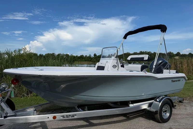 The Image of 2026 Tidewater 180 CC Adventure boat on trailer, set against a scenic outdoor backdrop. - 0
