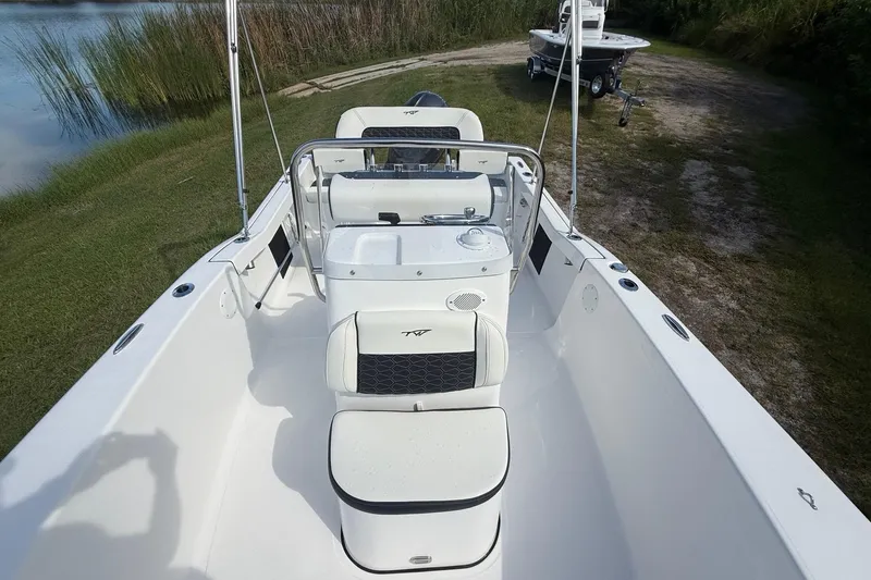 Slide: The Image of 2026 Tidewater 180 CC Adventure boat interior, featuring sleek seating and control console. - 19
