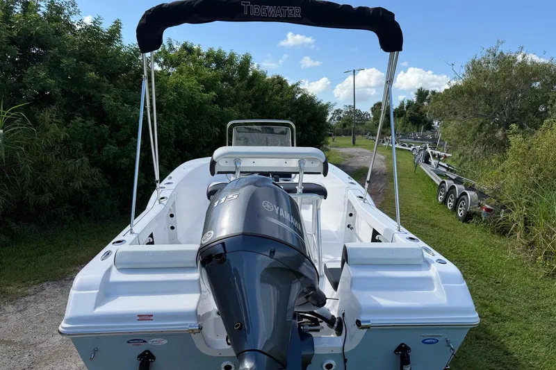 Slide: The Image of 2026 Tidewater 180 CC Adventure boat with Yamaha 115 engine, parked outdoors. - 4