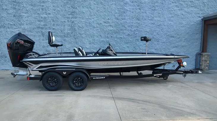The Image of 2026 Phoenix 721zxl boat on trailer, parked against a gray wall. - 1