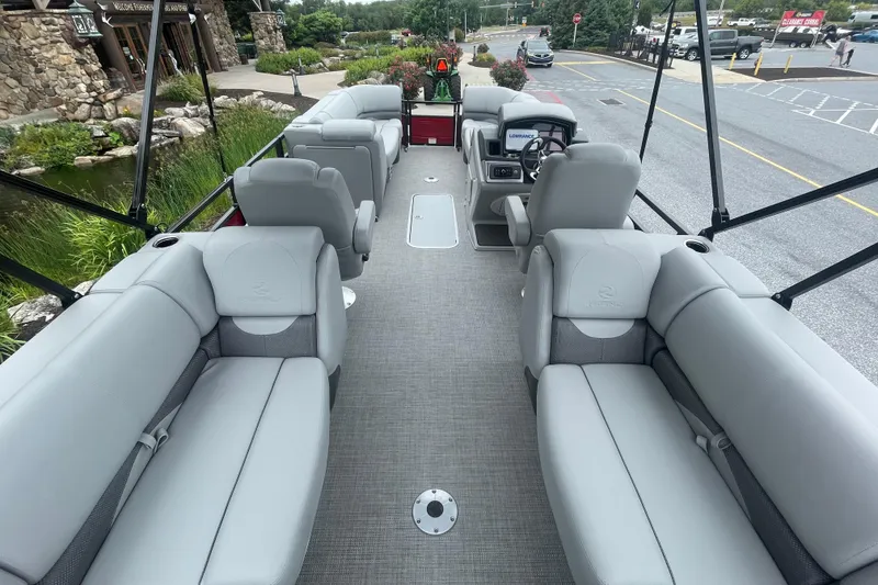 Slide: The Image of 2025 Regency 230 DL3 pontoon boat with spacious seating and modern design. - 3