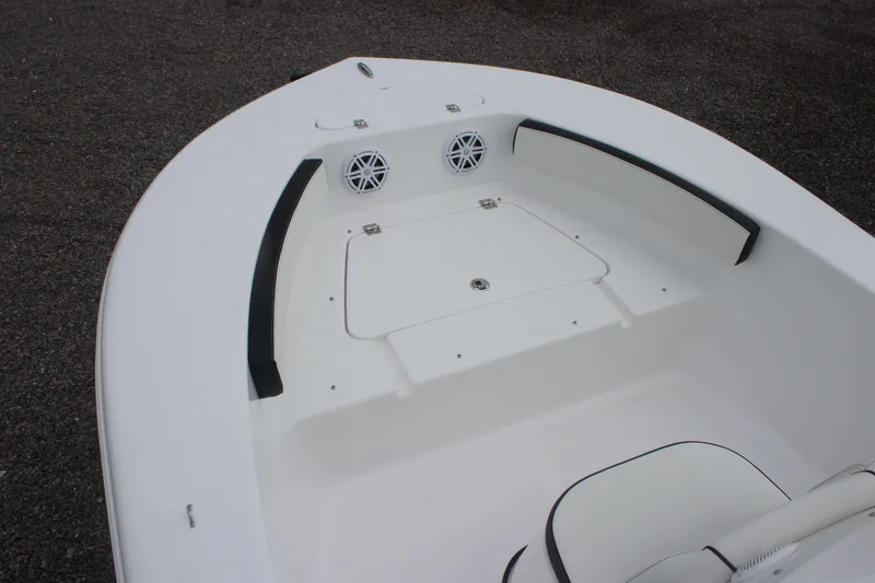 Slide: The Image of 2026 Tidewater 180 CC Adventure boat interior with seating and speakers. - 18