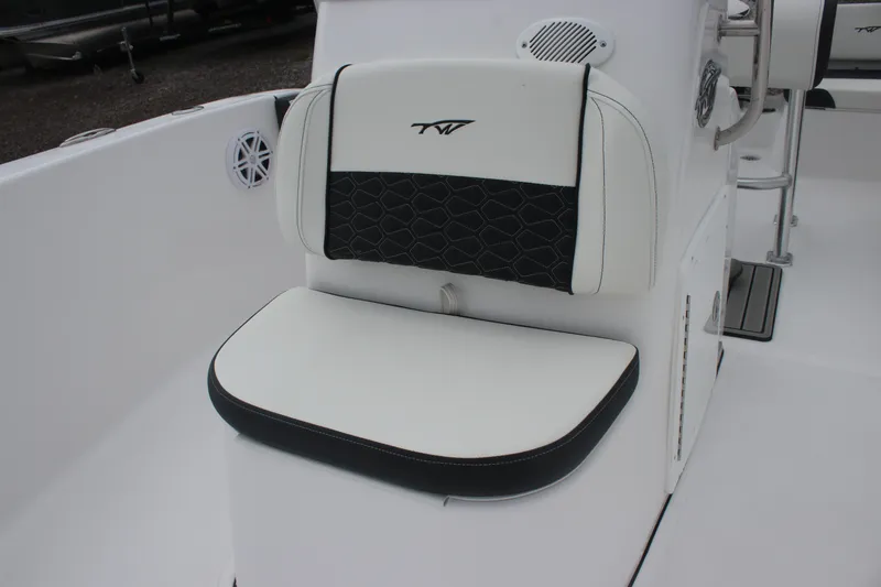 Slide: The Image of 2026 Tidewater 180 CC Adventure boat seat with black and white upholstery. - 2