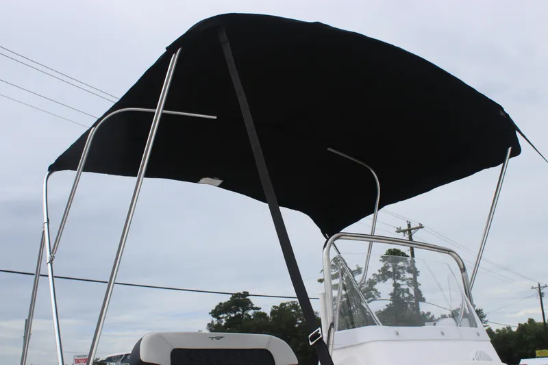 Slide: The Image of 2026 Tidewater 180 CC Adventure boat with black canopy and windshield. - 4