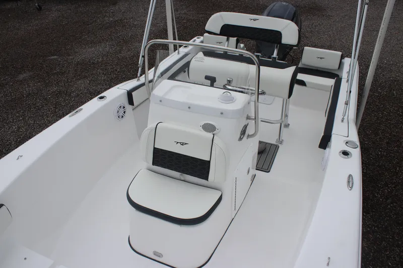 Slide: The Image of 2026 Tidewater 180 CC Adventure boat interior with white seating and console. - 5