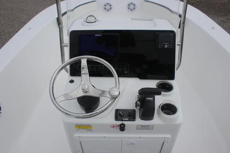 Slide: The Image of 2026 Tidewater 180 CC Adventure boat console with steering wheel and navigation controls. - 7