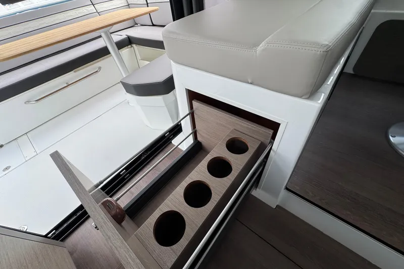 Slide: The Image of 2026 Jeanneau NC 1095 boat deck at marina, showcasing sleek design and spacious layout. - 16