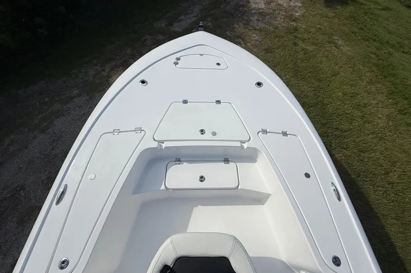 Slide: The Image of 2026 Tidewater 2110 Bay Max boat deck with storage compartments, viewed from above. - 17