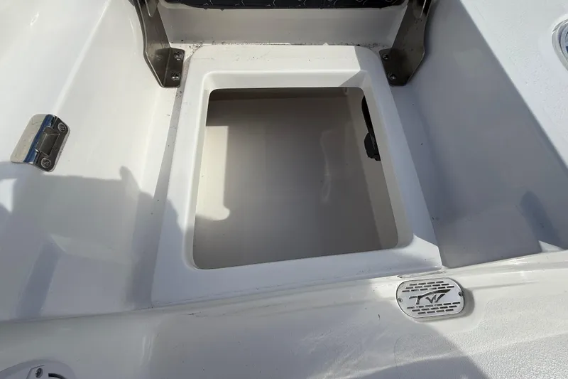 Slide: The Image of 2026 Tidewater 2110 Bay Max boat storage compartment, open and empty. - 27