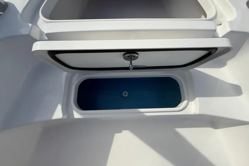 Slide: The Image of Open storage compartment on 2026 Tidewater 2110 Bay Max boat. - 33