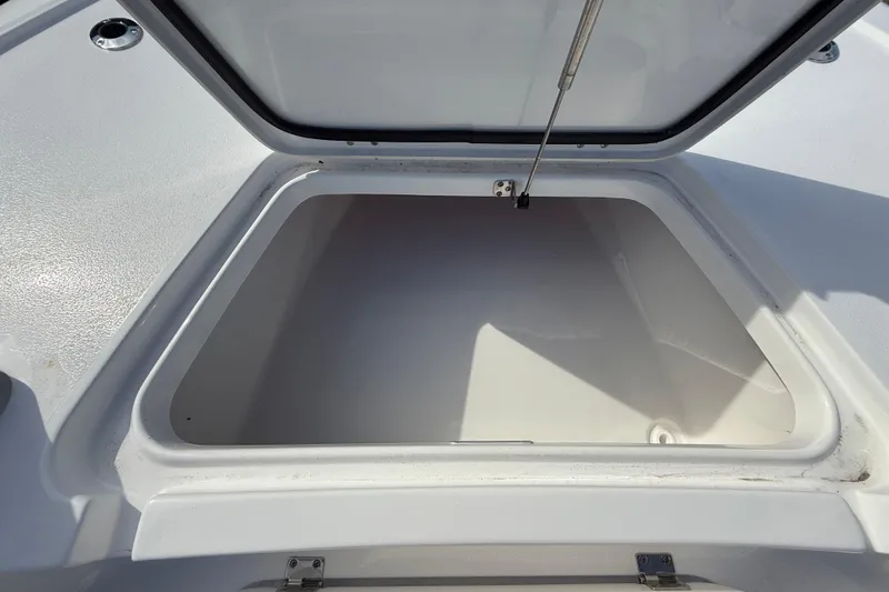 Slide: The Image of Open storage compartment on 2026 Tidewater 2110 Bay Max boat. - 35