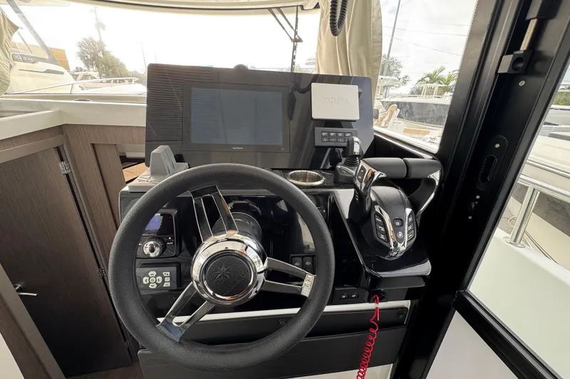 Slide: The Image of Interior view of 2026 Jeanneau NC 895 Sport Series 2 cabin with modern wood finish. - 11
