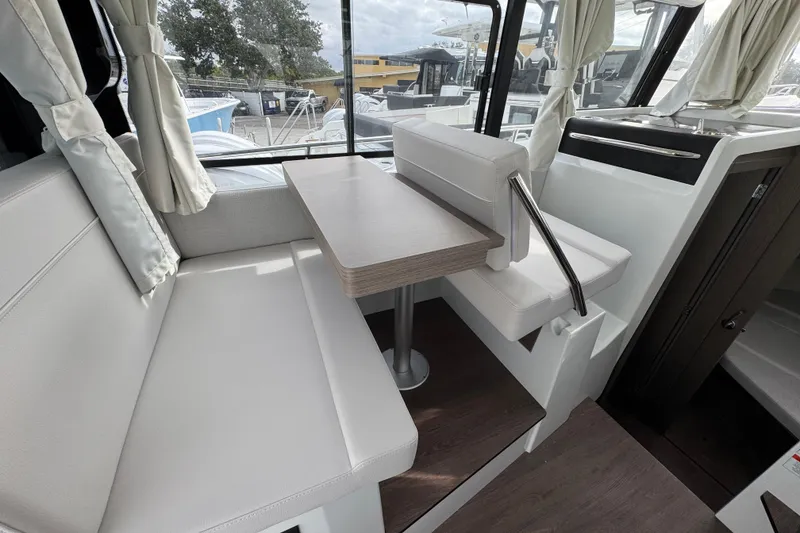 Slide: The Image of Cozy cabin interior of 2026 Jeanneau NC 895 Sport Series 2 with elegant decor. - 13