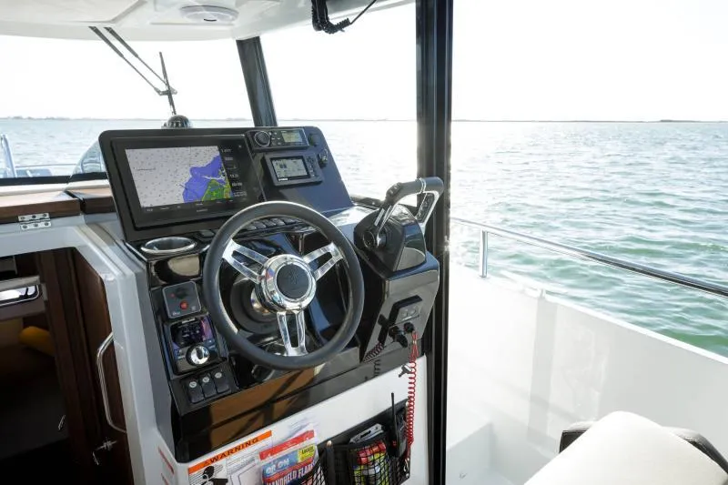 Slide: The Image of 2026 Jeanneau NC 895 Sport Series 2 boat interior with grill and sink setup. - 5