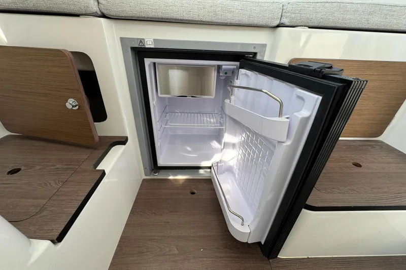 Slide: The Image of Compact fridge in 2026 Jeanneau NC Sport 795 Series 2 boat interior. - 20