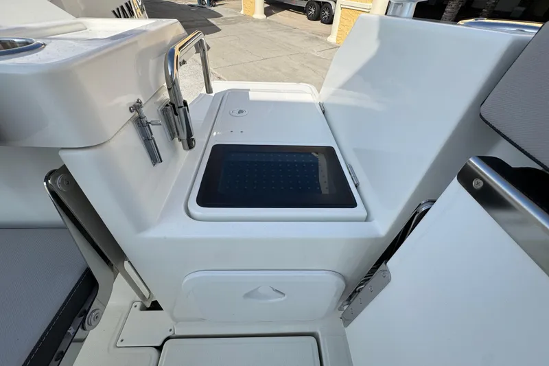 Slide: The Image of 2026 Jeanneau NC Sport 795 Series 2 boat interior with storage compartment. - 7