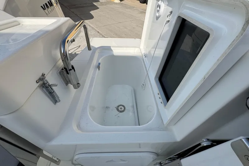 Slide: The Image of 2026 Jeanneau NC Sport 795 Series 2 boat interior with sink and storage compartment. - 8