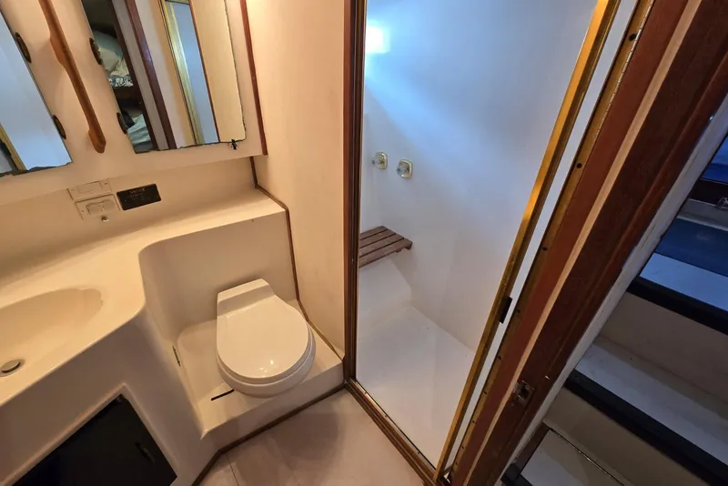 Slide: The Image of Bathroom interior of 1988 Topaz 44 Flybridge yacht with shower and toilet. - 13