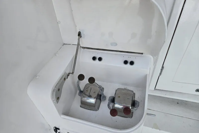 Slide: The Image of Control panel of a 1988 Topaz 44 Flybridge boat with dual levers. - 16