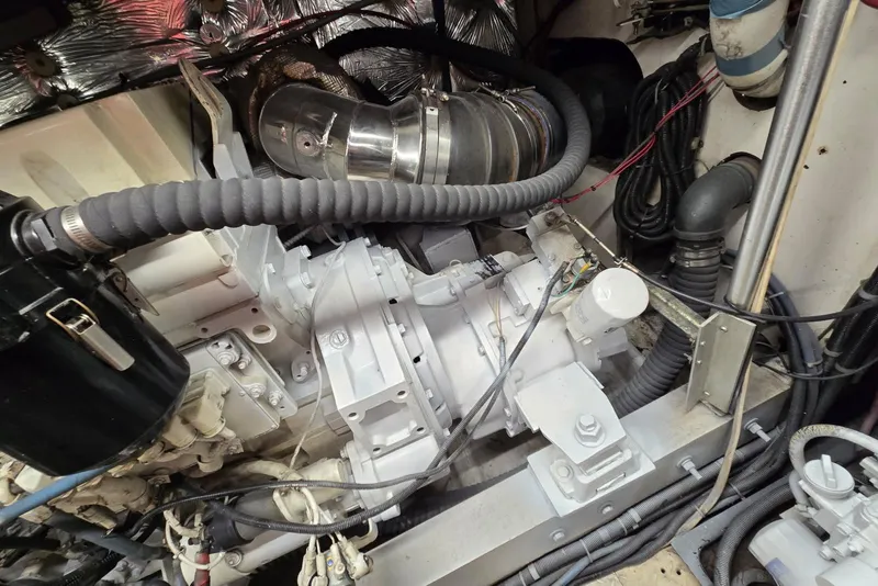 Slide: The Image of Engine room of 1988 Topaz 44 Flybridge with visible components and wiring. - 27