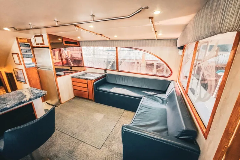 Slide: The Image of Interior of 1988 Topaz 44 Flybridge yacht with seating and kitchenette. - 39