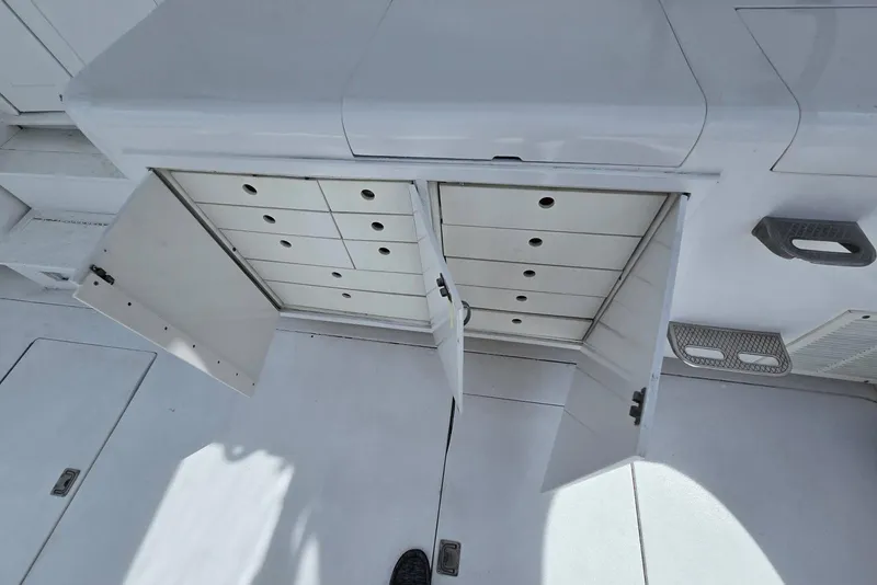 Slide: The Image of Open storage compartments on 1988 Topaz 44 Flybridge boat deck. - 4
