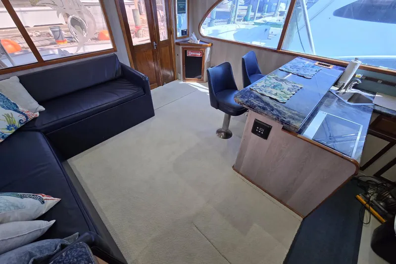 Slide: The Image of Interior of 1988 Topaz 44 Flybridge yacht with seating and dining area. - 41
