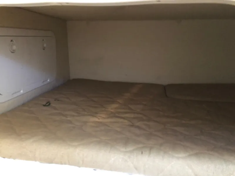 Slide: The Image of 2007 Pursuit OS 335 Offshore boat cockpit with steering wheel and navigation controls. - 27