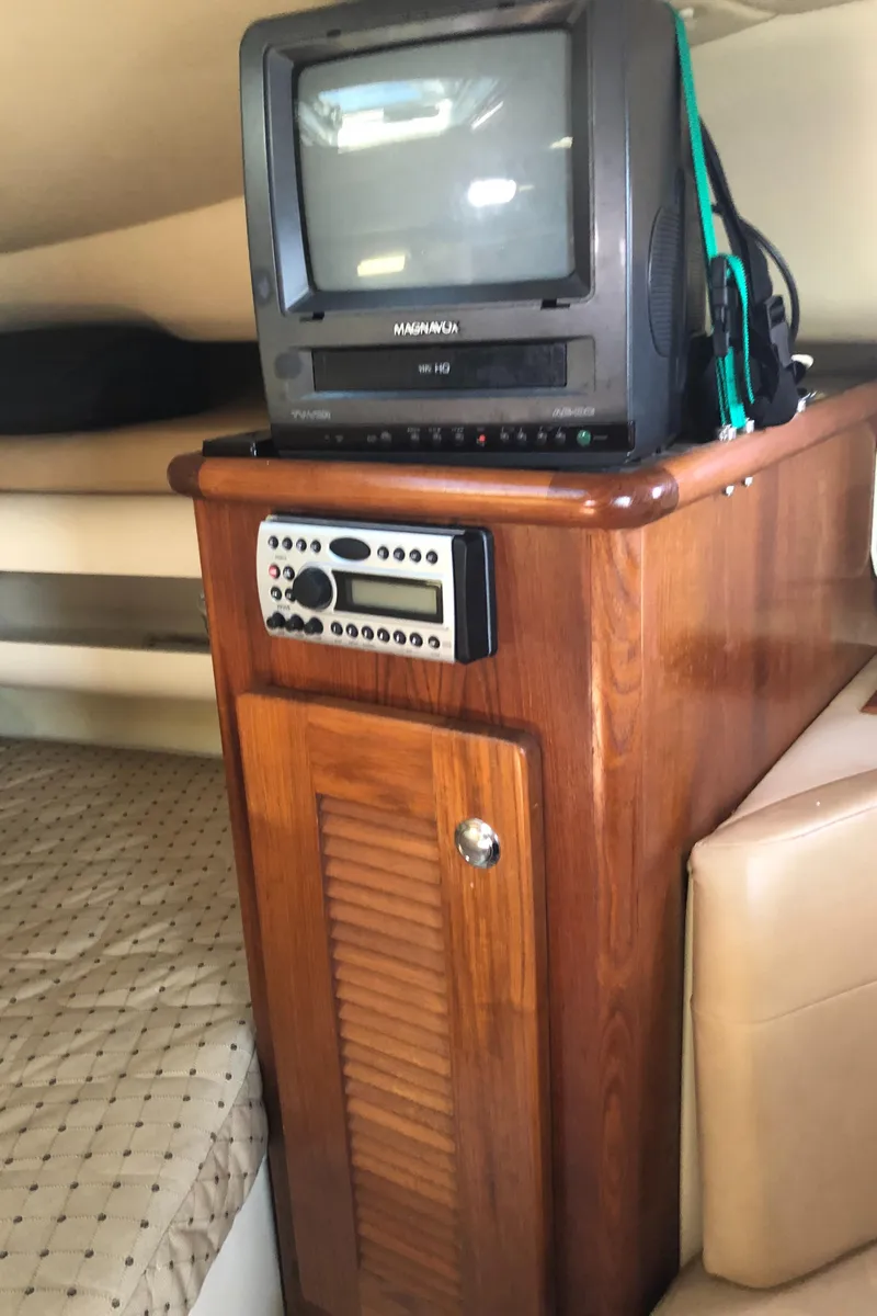 Slide: The Image of Cozy cabin interior of 2007 Pursuit 335 Offshore with plush bedding and pillows. - 29