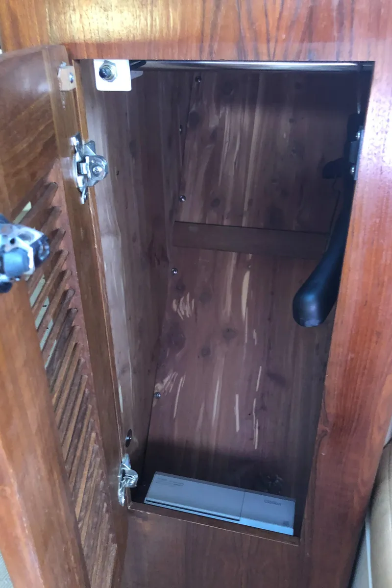 Slide: The Image of Interior cabin of a 2007 Pursuit 335 Offshore boat with a beige mattress. - 30