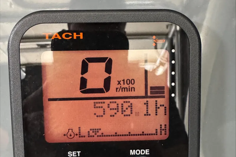 Slide: The Image of Tachometer display showing 0 RPM and 590.1 hours on a 2007 Pursuit OS 335 Offshore. - 39