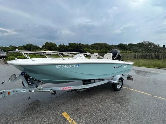 The Image of 2023 Boston Whaler 160 Super Sport boat on trailer, parked outdoors. - 0