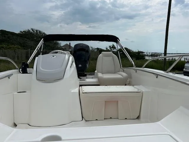Slide: The Image of 2023 Boston Whaler 160 Super Sport boat on trailer, parked outdoors. - 3