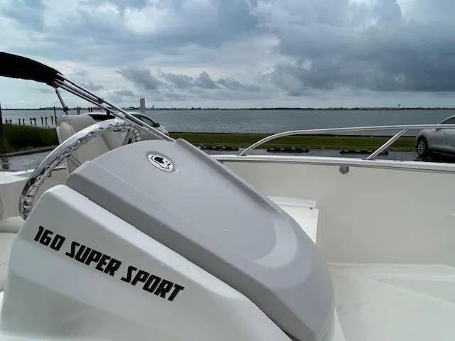 Slide: The Image of Close-up of a Mercury FourStroke engine on a 2023 Boston Whaler 160 Super Sport boat. - 6