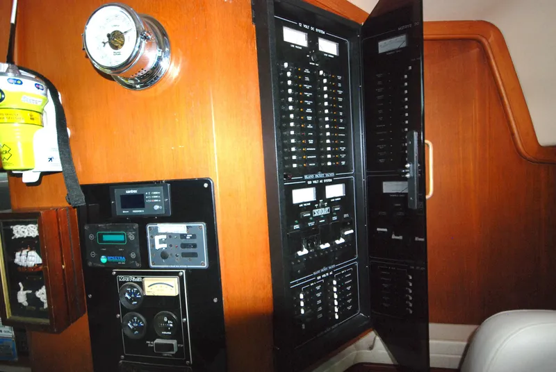 Slide: The Image of Control panel of a 2003 Island Packet 485 yacht, featuring various gauges and switches. - 17