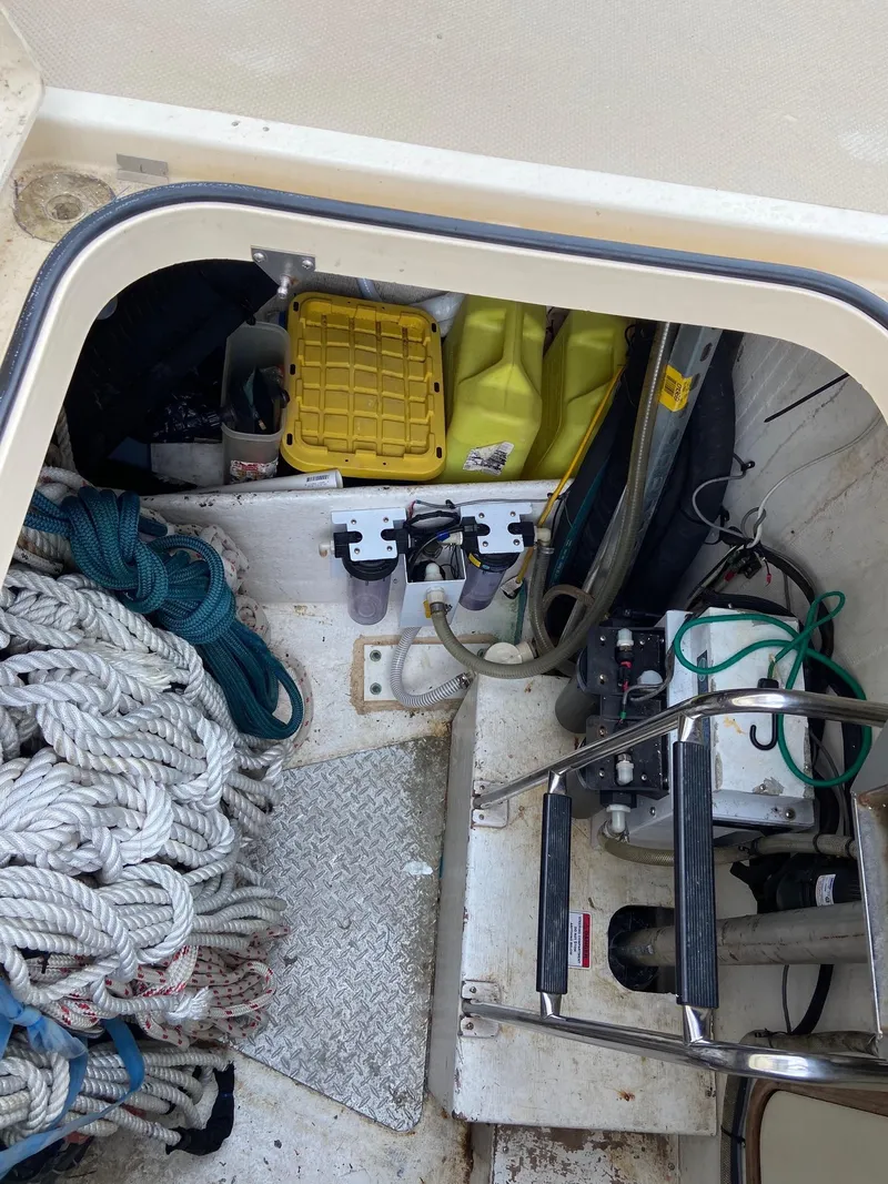 Slide: The Image of Storage compartment of 2003 Island Packet 485 sailboat with ropes and equipment. - 37