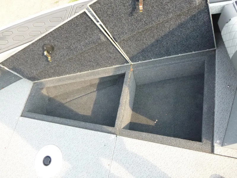 Slide: The Image of Open storage compartments on a 2025 KingFisher 2125 Arrow Sport boat. - 16
