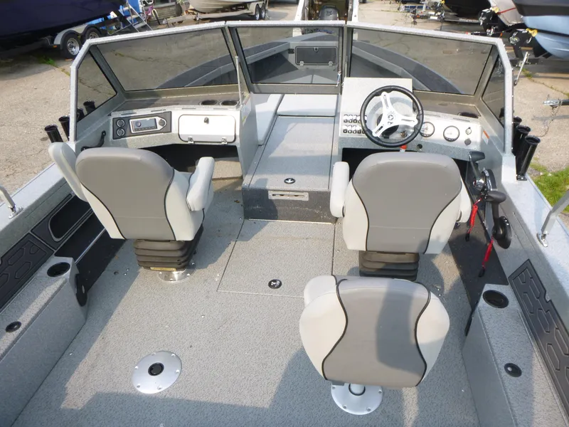 Slide: The Image of Interior of 2025 KingFisher 2125 Arrow Sport boat with dual seats and steering console. - 5