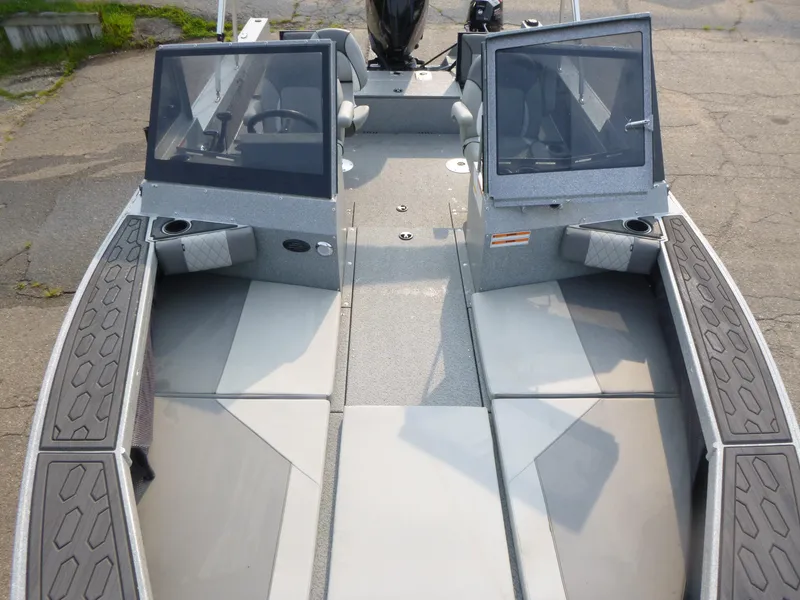 Slide: The Image of 2025 KingFisher 2125 Arrow Sport boat interior with dual consoles and seating. - 6