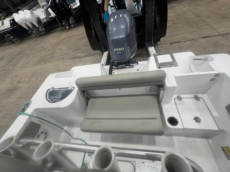Slide: The Image of 2023 Sportsman 212 boat interior with Yamaha 200 engine, seating, and storage compartments. - 10
