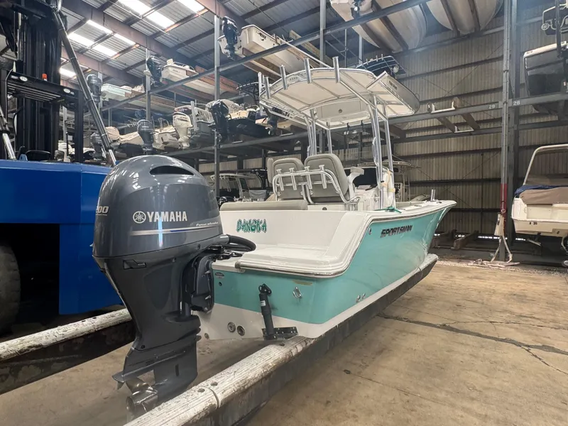 Slide: The Image of 2023 Sportsman 212 boat with Yamaha engine in storage facility. - 11